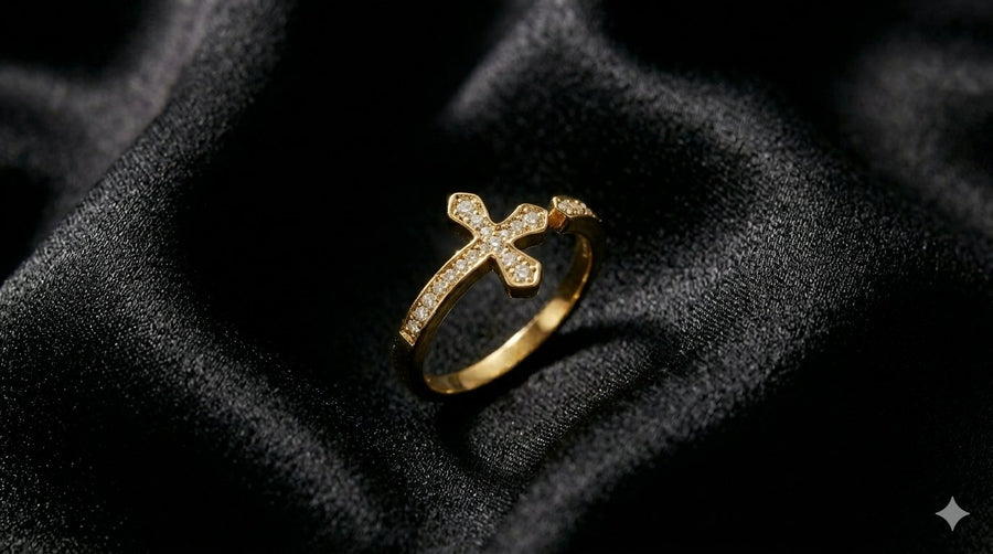 The Meridian Ring, a gold cross ring with pavé stones, on black satin